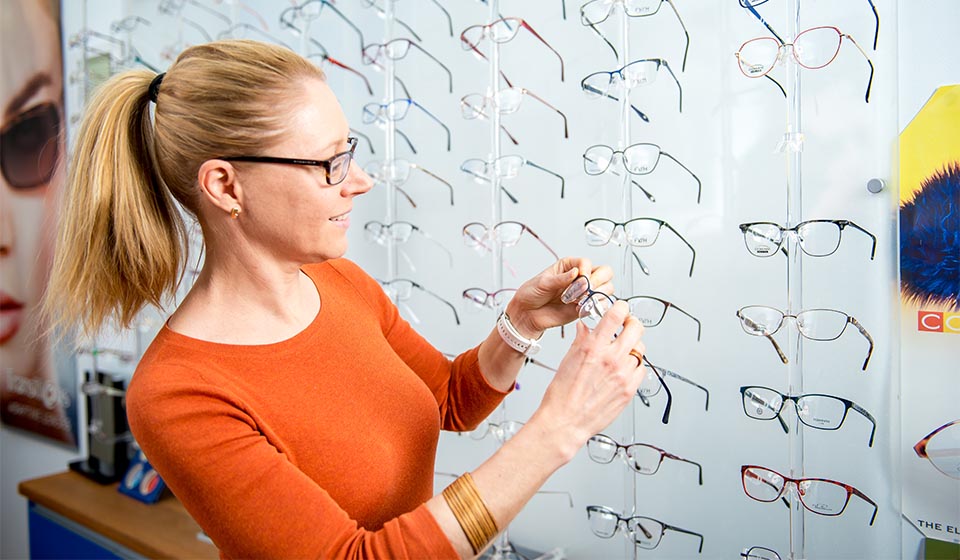 Customer looking at glasses frame